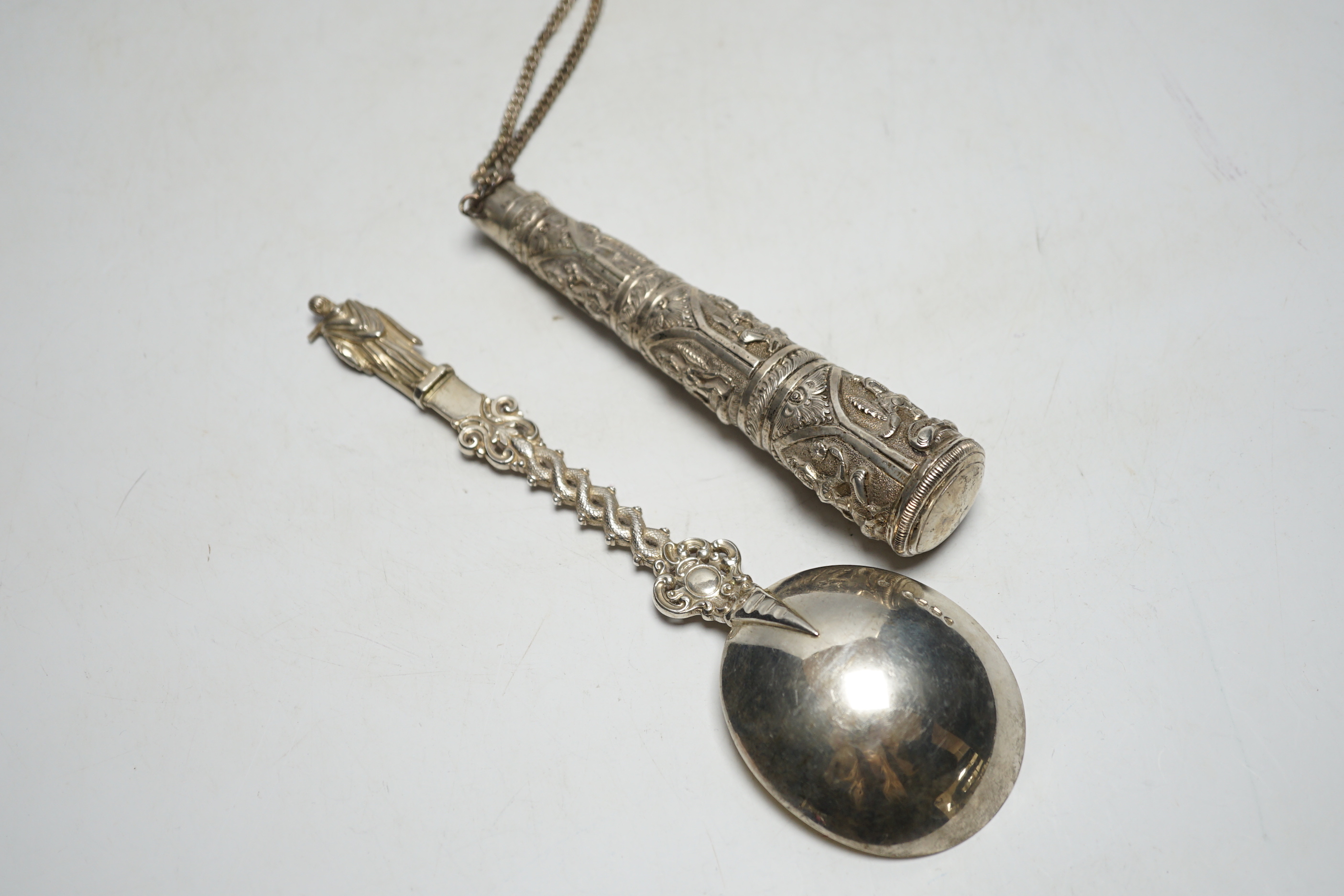 A Victorian silver apostle spoon, Francis Higgins, London, 1884, 20.2cm and an Indian white metal cane handle.